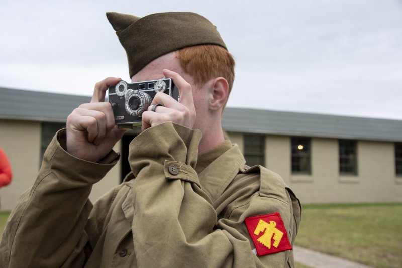 Daniel Hollenbaugh takes an analog photo of the Submarine Surrender during Fort Miles Defense Day.